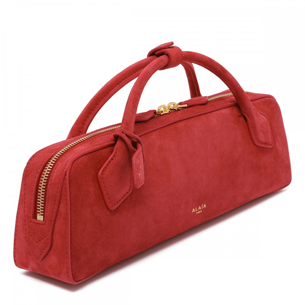 Le Teckel suede clutch bag