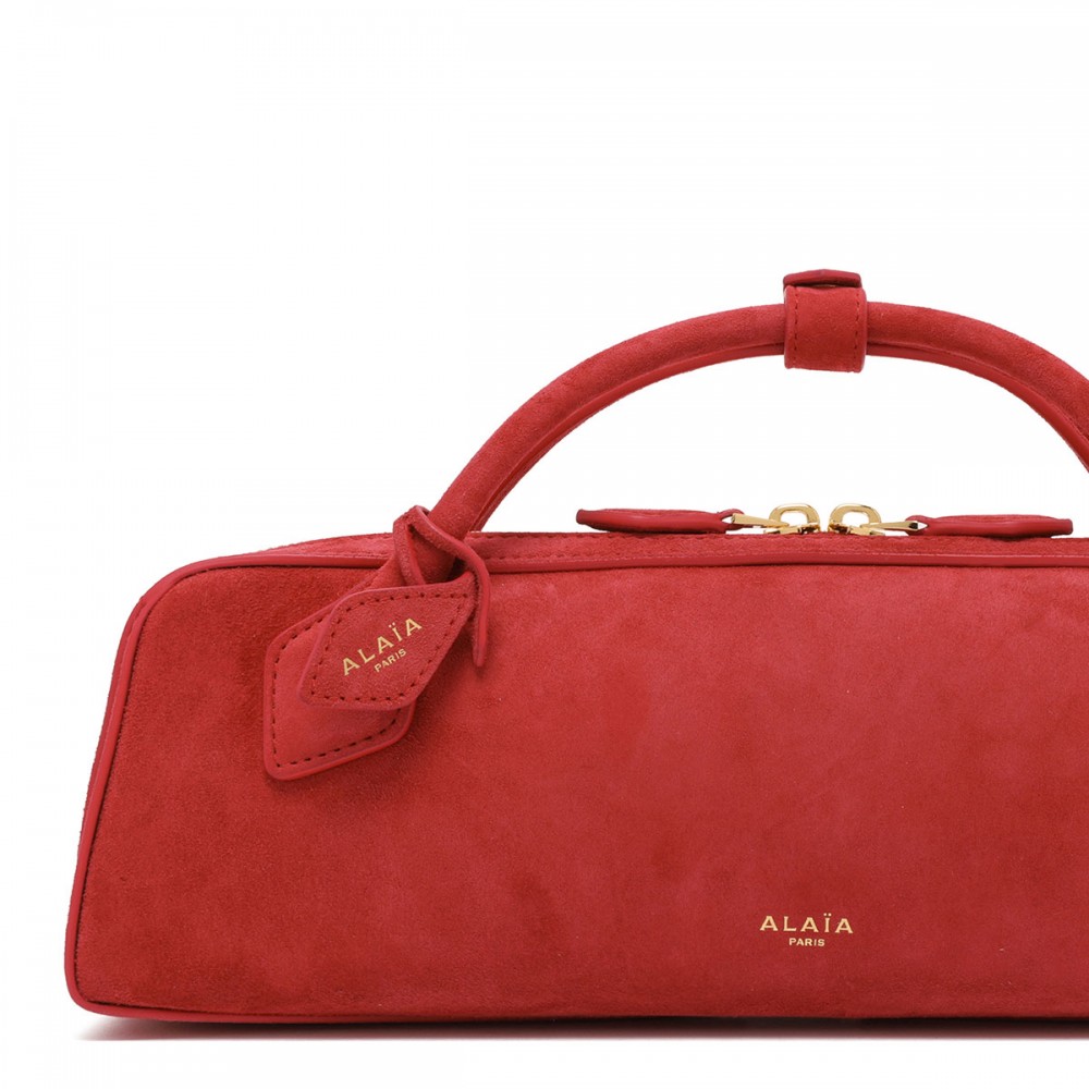 Le Teckel suede clutch bag