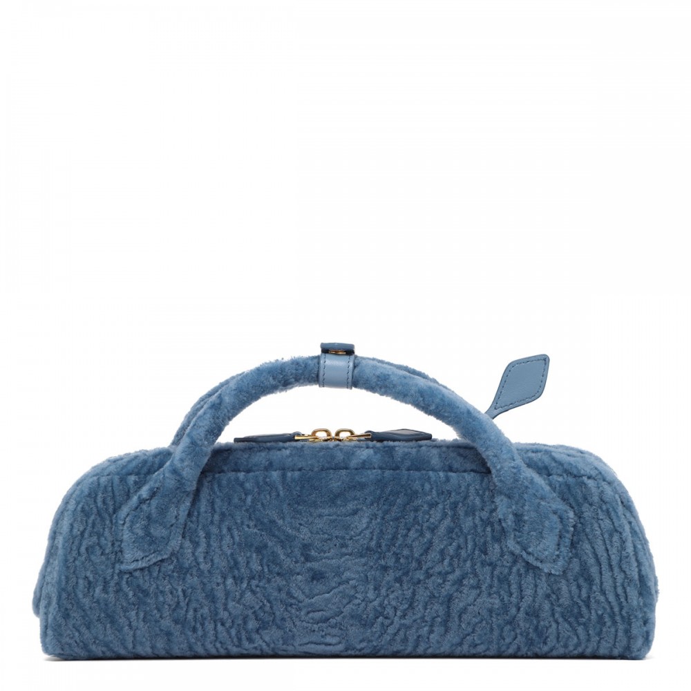 Le Teckel shearling clutch bag