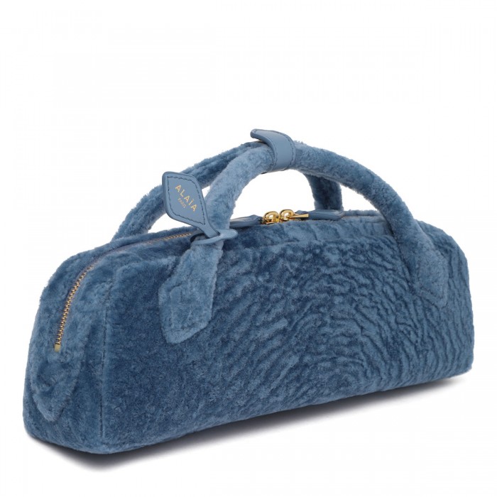 Le Teckel shearling clutch bag