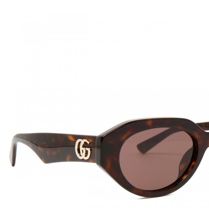 Brown tortoiseshell oval sunglasses
